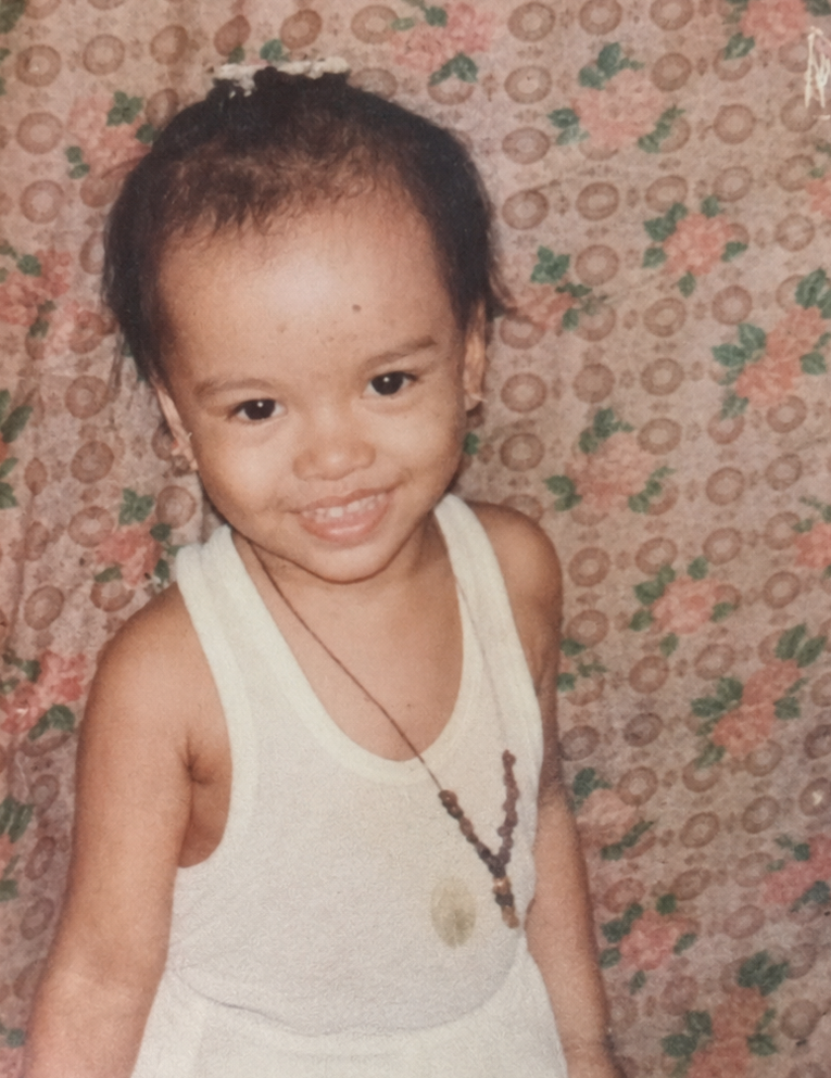 Vergielyn Cubol as a young child growing up in a sugarcane farming town in the Philippines